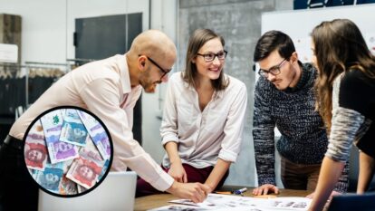 Imagen de referencia // personas trabajando // En el círculo billetes colombianos // Getty Images
