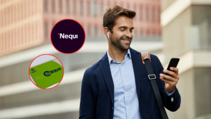 Imagen de alguien viendo su teléfono con las fotos del logo de Nequi y una tarjeta Tullave. Créditos de Getty Images